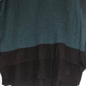 Green and black sweater. Worn in!